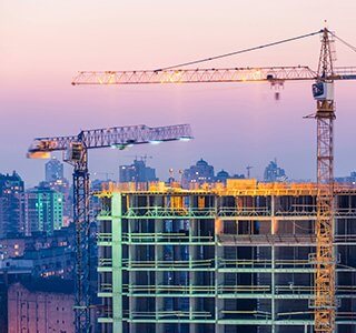 Cranes in the city by construction site